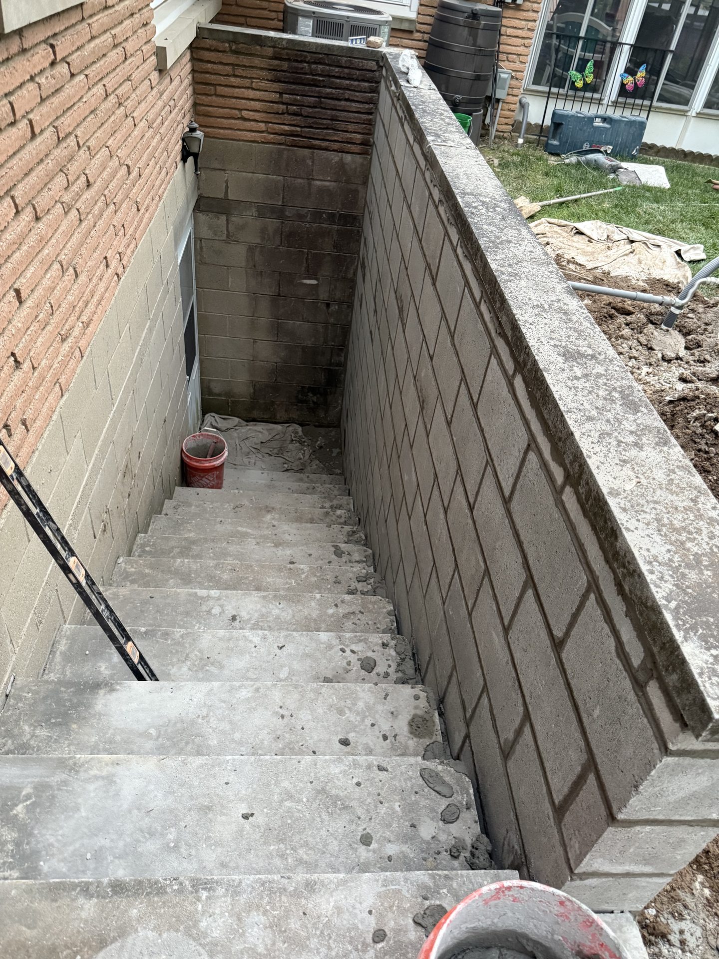 Basement concrete stairs and block retaining wall masonry in Indianapolis, IN Basement concrete stairs and block retaining wall masonry in Indianapolis, IN