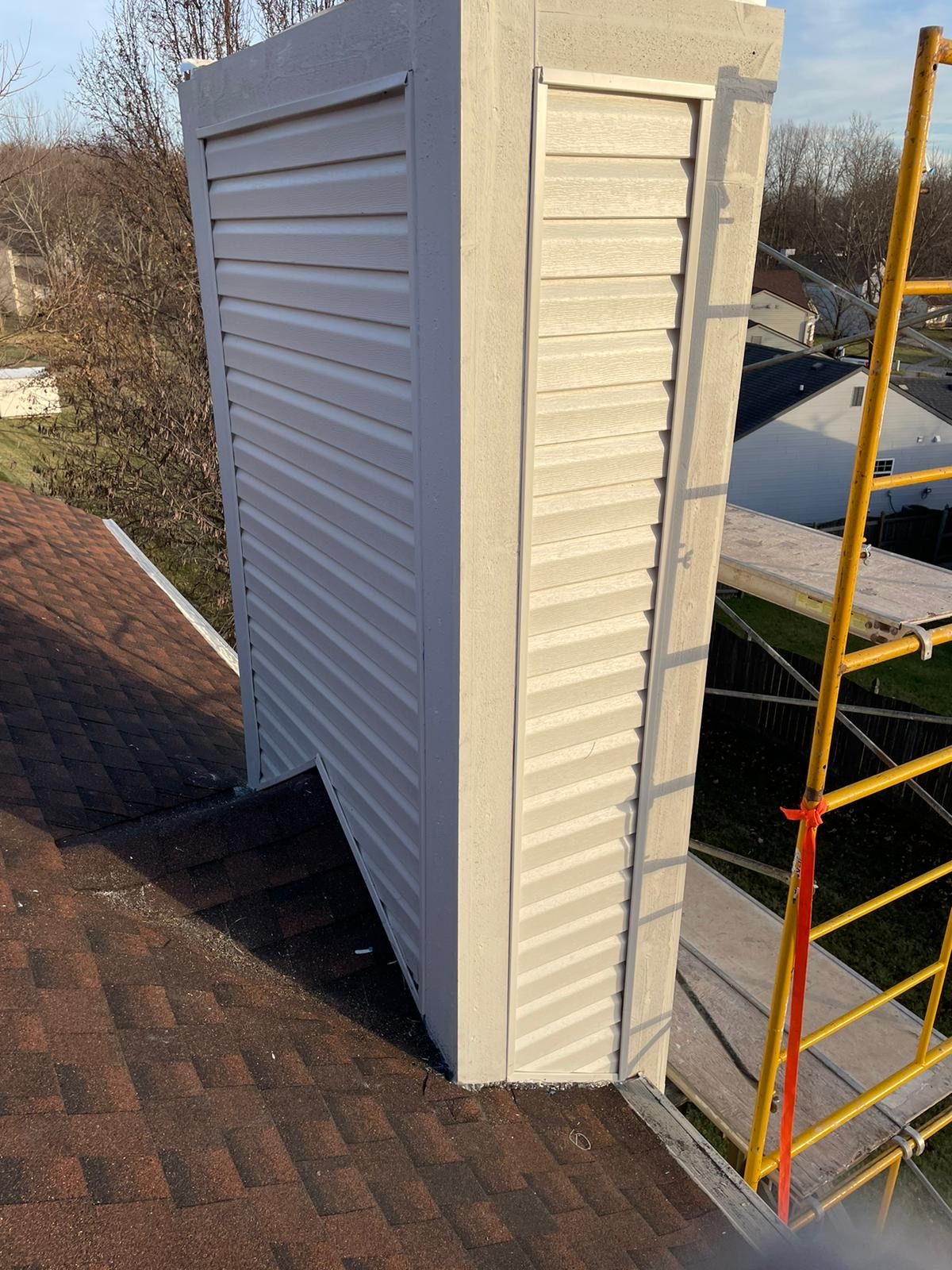 Chimney chase restoration on a residential roof in Indianapolis, IN Chimney chase restoration on a residential roof in Indianapolis, IN