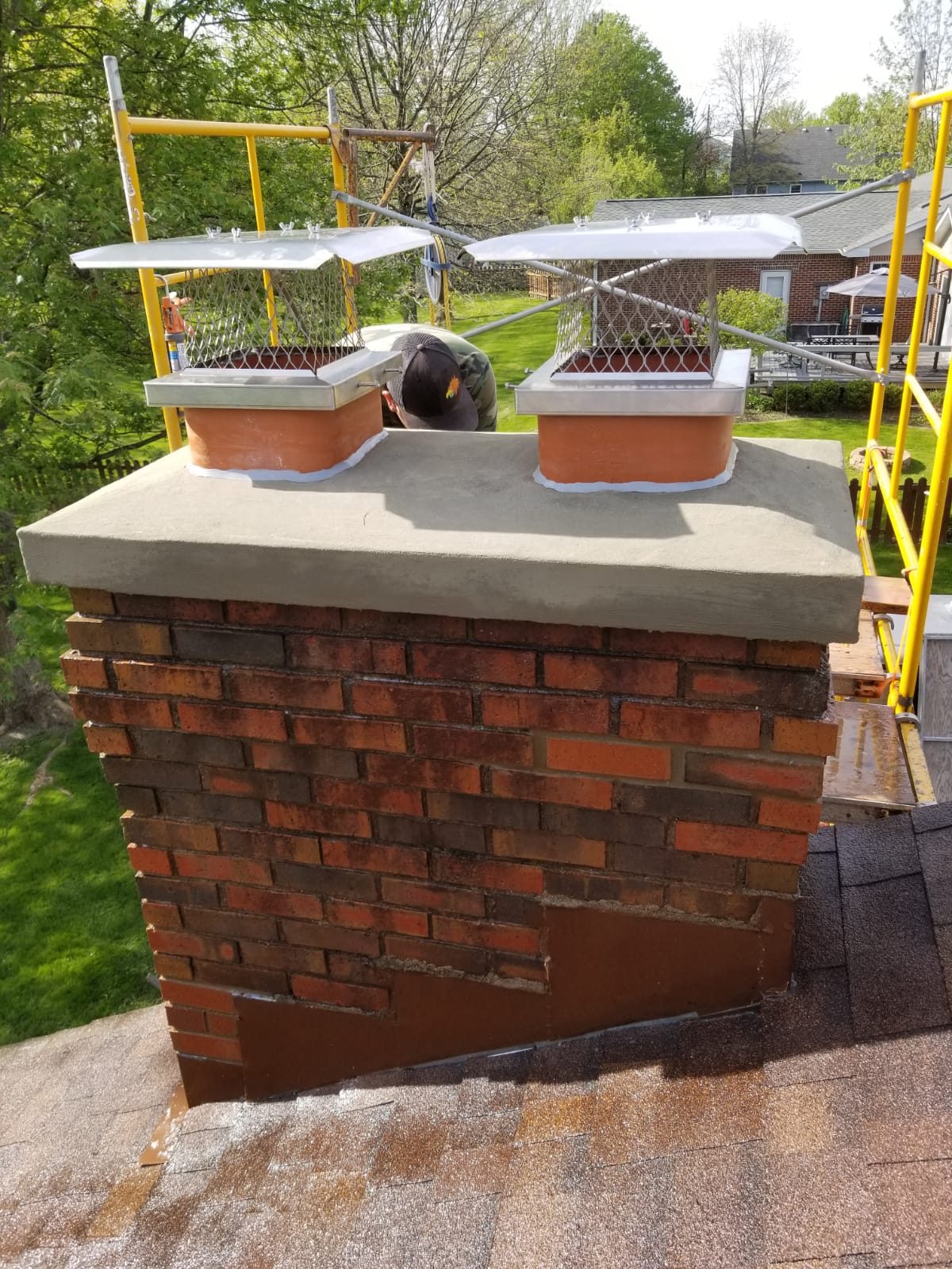 Brick chimney crown repair with stainless caps by masonry contractor Indianapolis, IN Brick chimney crown repair with stainless caps by masonry contractor Indianapolis, IN