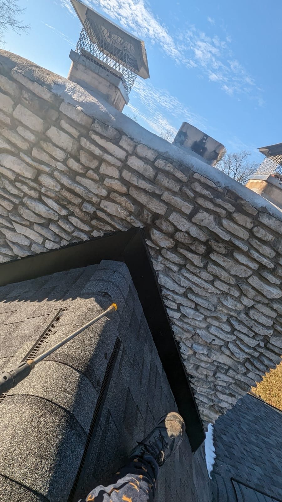 Stone chimney cleaning from the roof serving Indianapolis, IN and Marion County Stone chimney cleaning from the roof serving Indianapolis, IN and Marion County